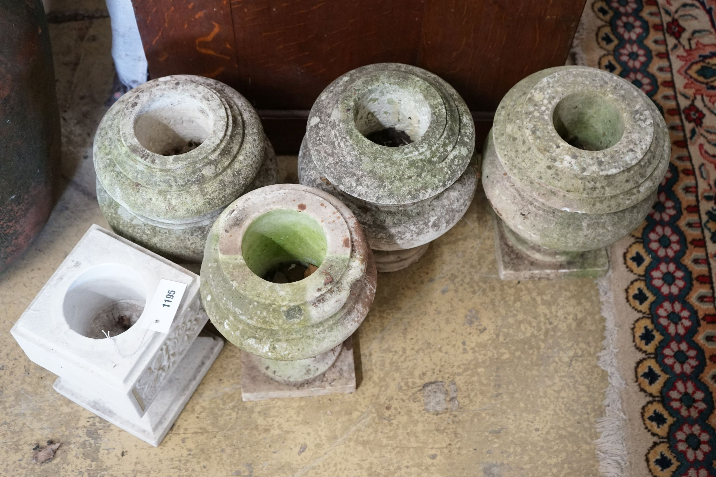 Five marble urns, largest height 31cm